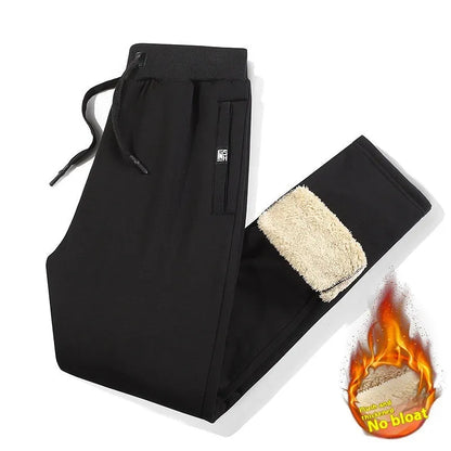 Grey fleece-lined men's cotton track pants with a drawstring waist shown in an oversized fit.