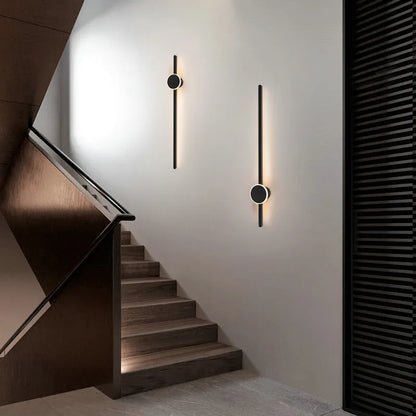 Modern strip wall lamp with acrylic shade mounted beside bed