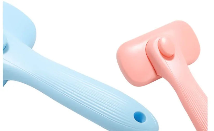 144g plastic pet needle comb for dogs and cats, shown in pink and blue colour options