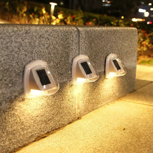 Solar garden wall lamp with waterproof housing mounted on brick wall