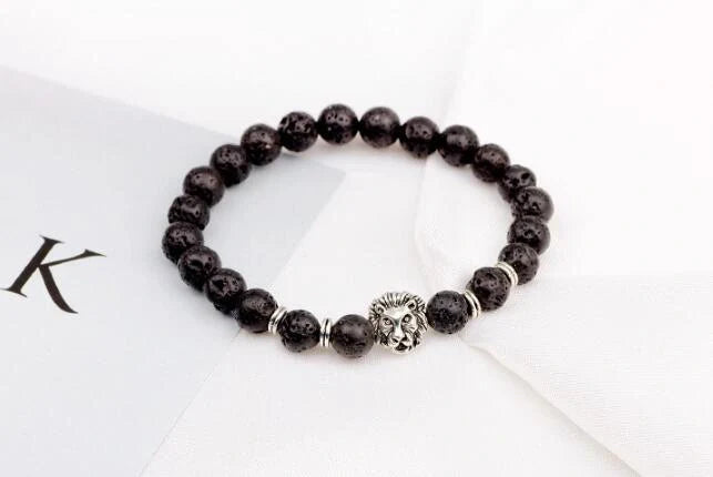Carved stone bracelet featuring a powerful lion design, meant to enhance confidence and style.