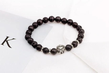Carved stone bracelet featuring a powerful lion design, meant to enhance confidence and style.