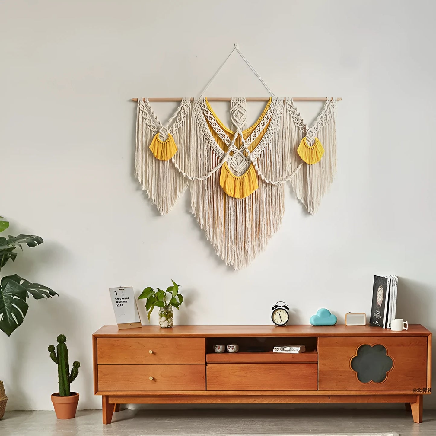 Creamy white hand-woven cotton tapestry with a rectangle shape for wall decor.