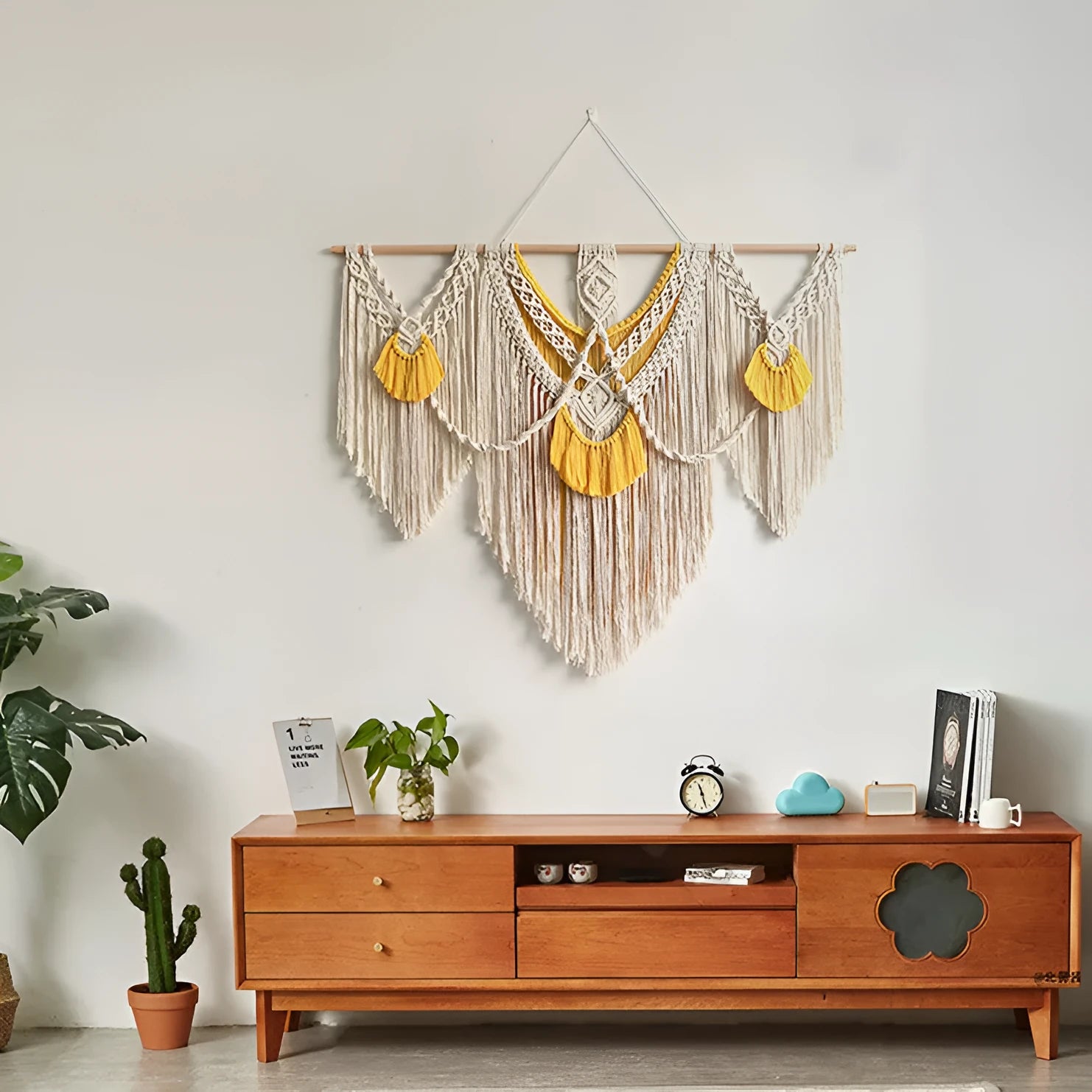 Creamy white hand-woven cotton tapestry with a rectangle shape for wall decor.