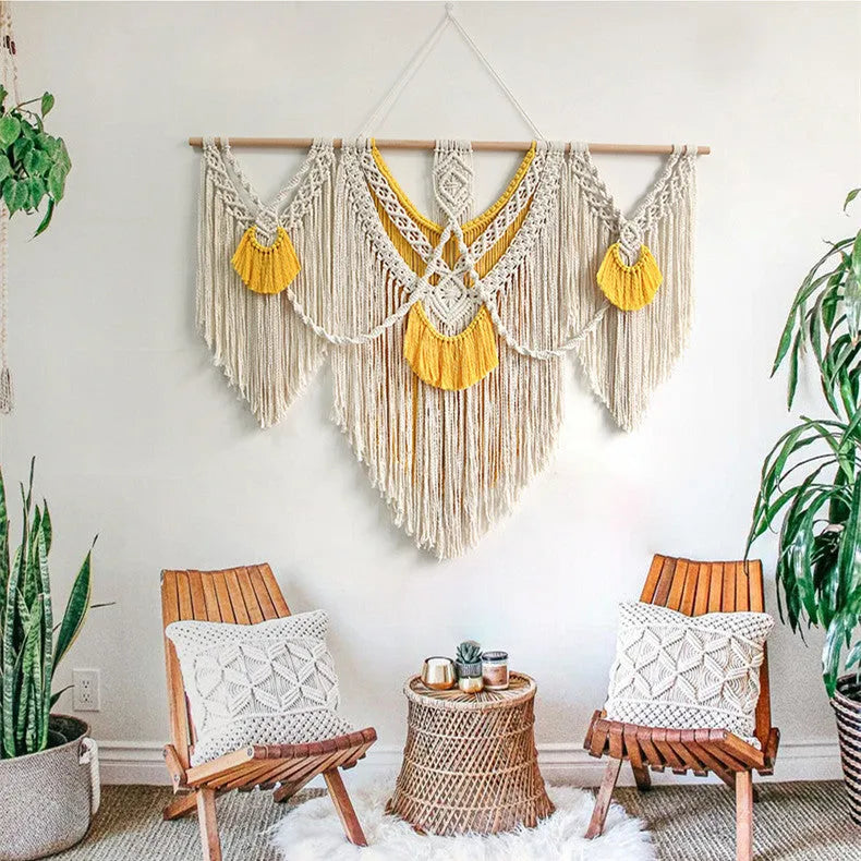 Creamy white hand-woven cotton tapestry with a rectangle shape for wall decor.