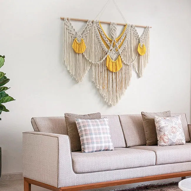 Creamy white hand-woven cotton tapestry with a rectangle shape for wall decor.