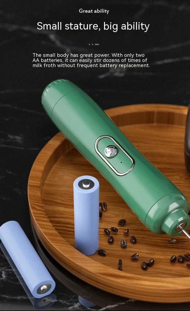 Battery-powered handheld milk frother in retro green, black, or white with stainless steel whisk