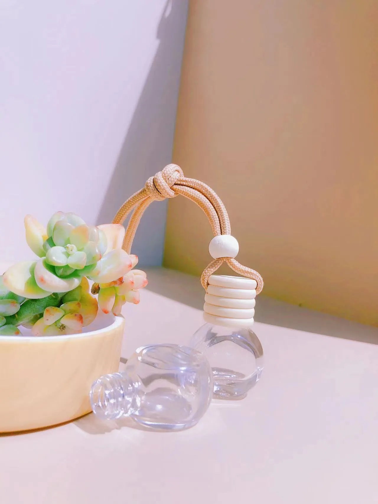 Car perfume pendant in four glass bottle styles: cylinder, diamond, flat drum, and square