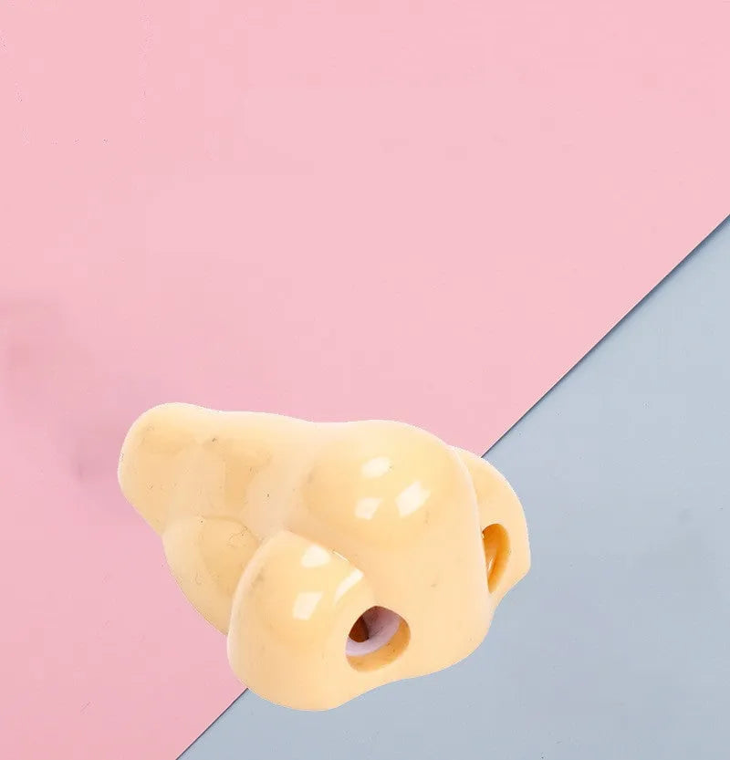 Geometry-shaped plastic pencil sharpener measuring 58x45x30mm in flesh colour