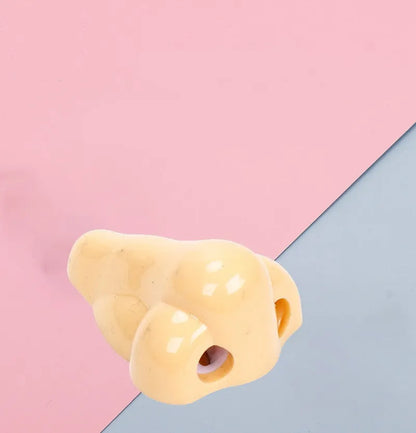 Geometry-shaped plastic pencil sharpener measuring 58x45x30mm in flesh colour