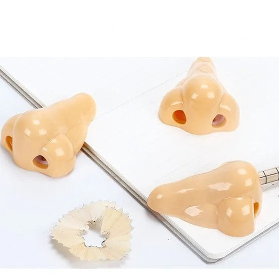 Geometry-shaped plastic pencil sharpener measuring 58x45x30mm in flesh colour