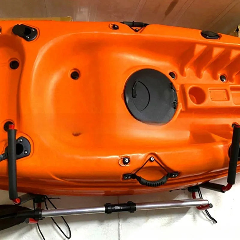 Carbon steel kayak wall hanger rack for mounting surfboards and paddleboards on a garage wall.