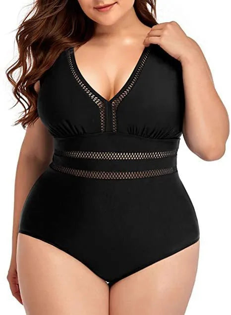 Black plus-size bikini swimsuit with print design and mesh fabric, shown on a hanger.