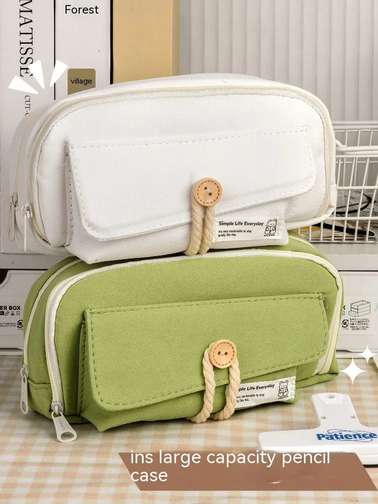 Korean-style canvas pencil case in four colours storing approximately 80 pens
