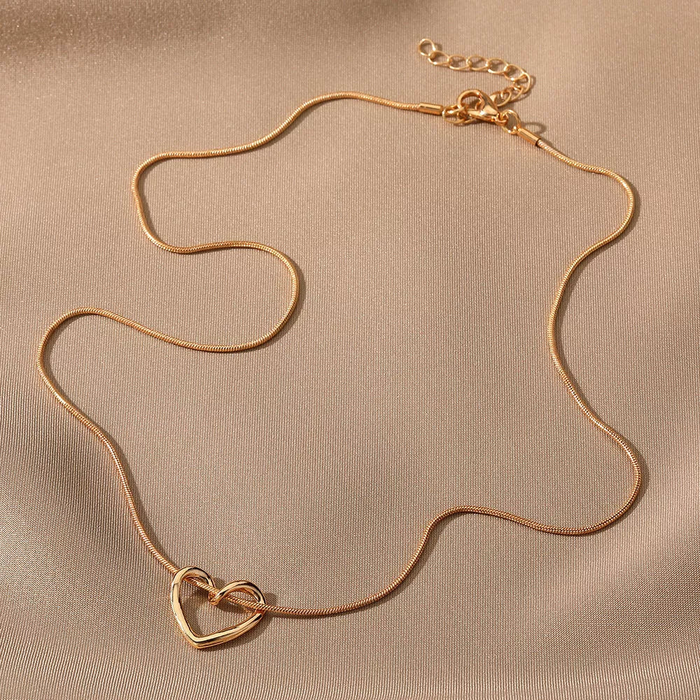 Niche Hollow Heart Necklace for women with snake bones chain and electroplated alloy
