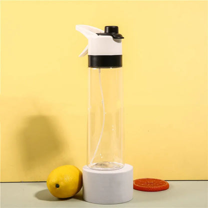 Large plastic spray water bottle with handle strap and leakproof lid in green colour.