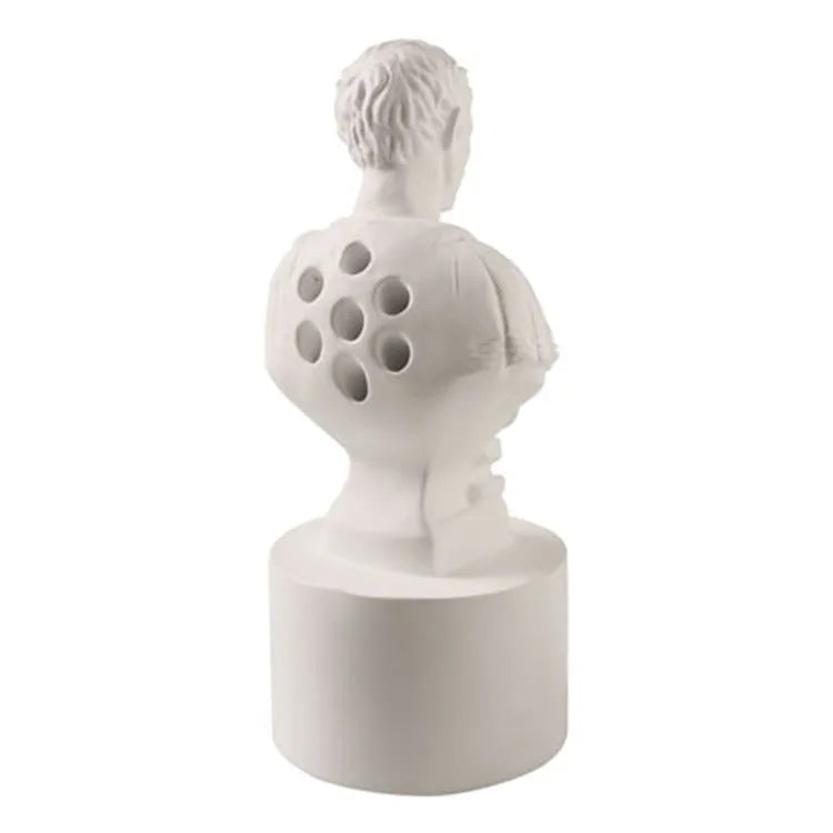 White American character modelling pen holder measuring 12cm tall on desk