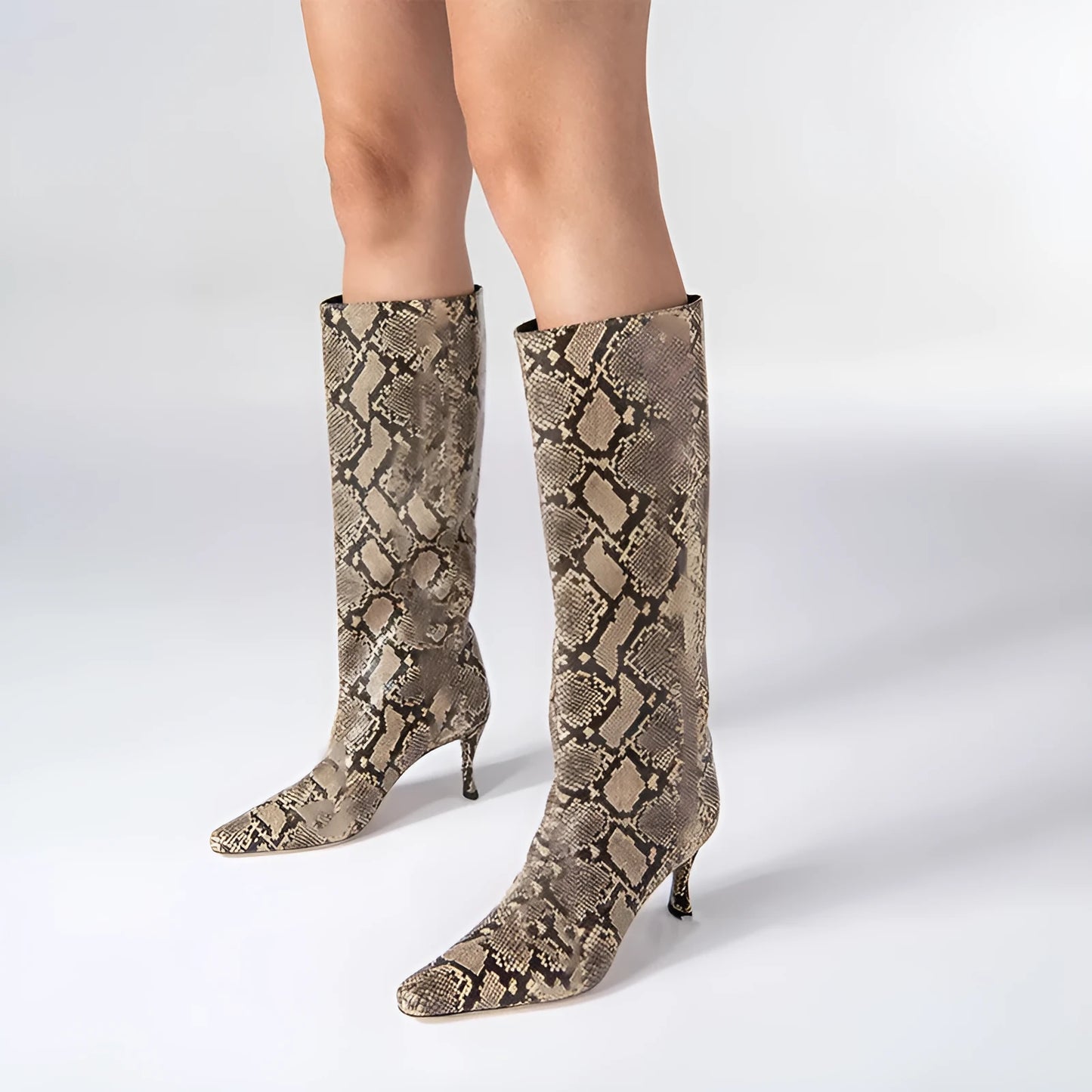 A pair of women's square toe cowboy boots in microfiber, shown in a selection of available colours.