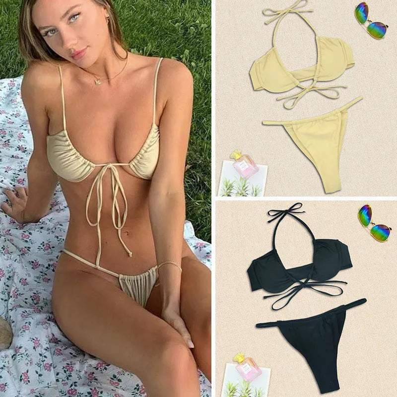 Women's black and mint green nylon bikini swimsuit set on a white background.