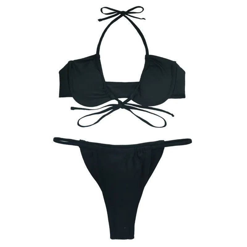 Women's black and mint green nylon bikini swimsuit set on a white background.