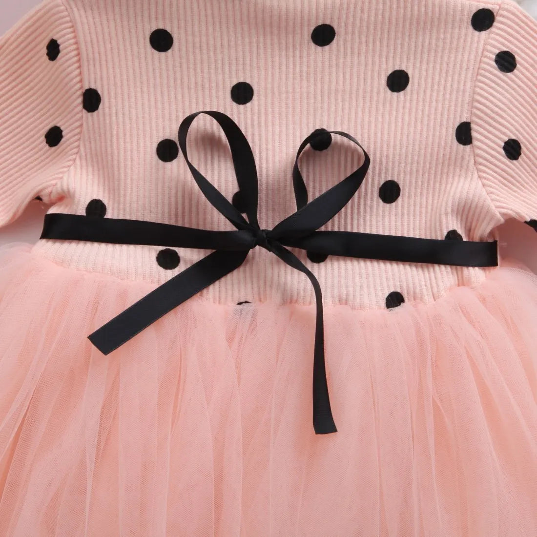 Baby girl's long sleeve black tutu lace dress with lace trim, shown on a hanger.