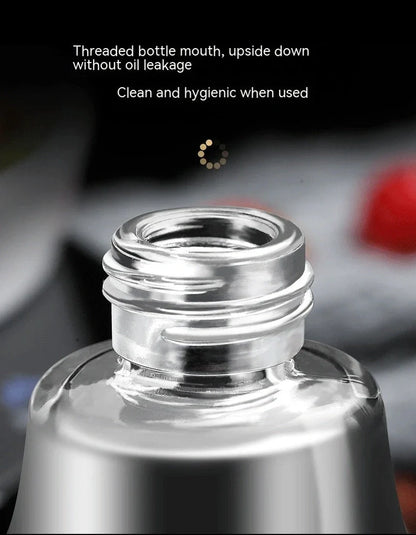 Clear glass kitchen oil dispenser, 100ml capacity, with stainless steel automatic nozzle and funnel, straight modern design