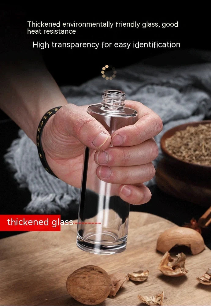 Clear glass kitchen oil dispenser, 100ml capacity, with stainless steel automatic nozzle and funnel, straight modern design