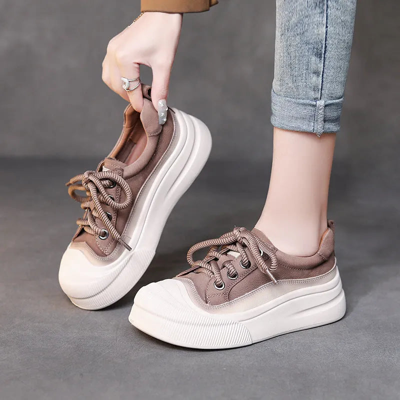 Women's brown leather lace-up casual shoes with round toe and rubber sole on white background
