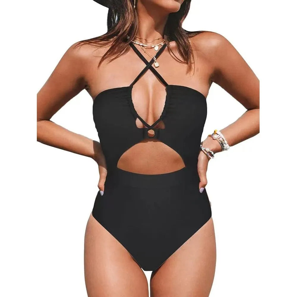 Black one-piece swimsuit on a model showing backless design