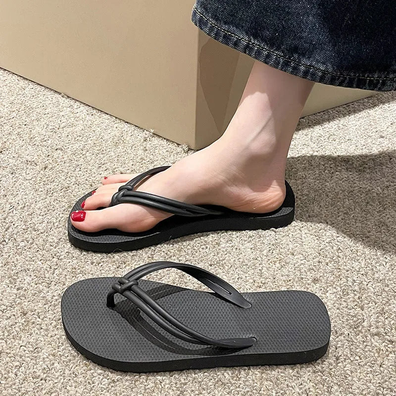 PVC injection moulded flip flops in toe-covering casual style with non-slip sole