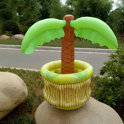 Green inflatable palm tree shaped cooler with coconut details holding beer bottles and ice