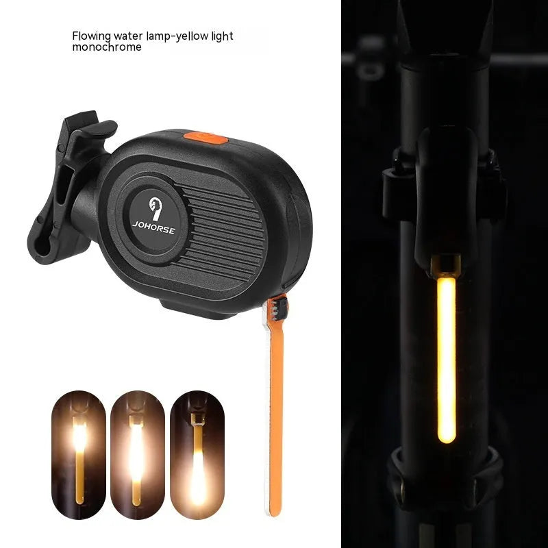 Bicycle rear safety light with a cascading waterfall LED light effect, mounted on a seat post.