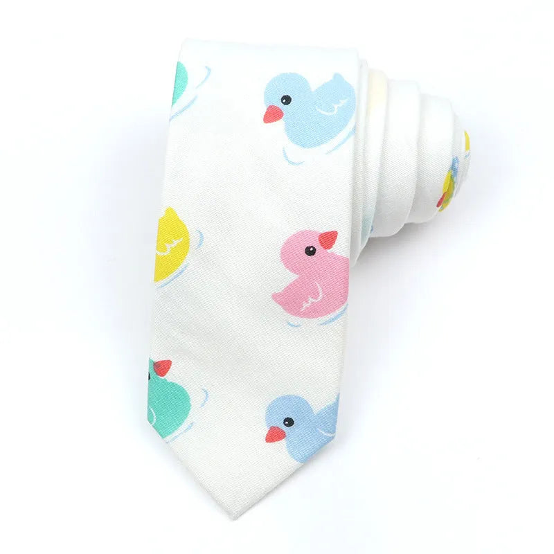 A narrow Korean-style cotton bow tie featuring a cartoon print, shown in a selection of colours.