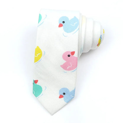 A narrow Korean-style cotton bow tie featuring a cartoon print, shown in a selection of colours.