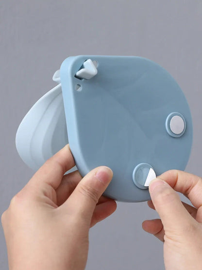 Blue bathroom soap dish with tree texture pattern and drainage channels on white ceramic sink