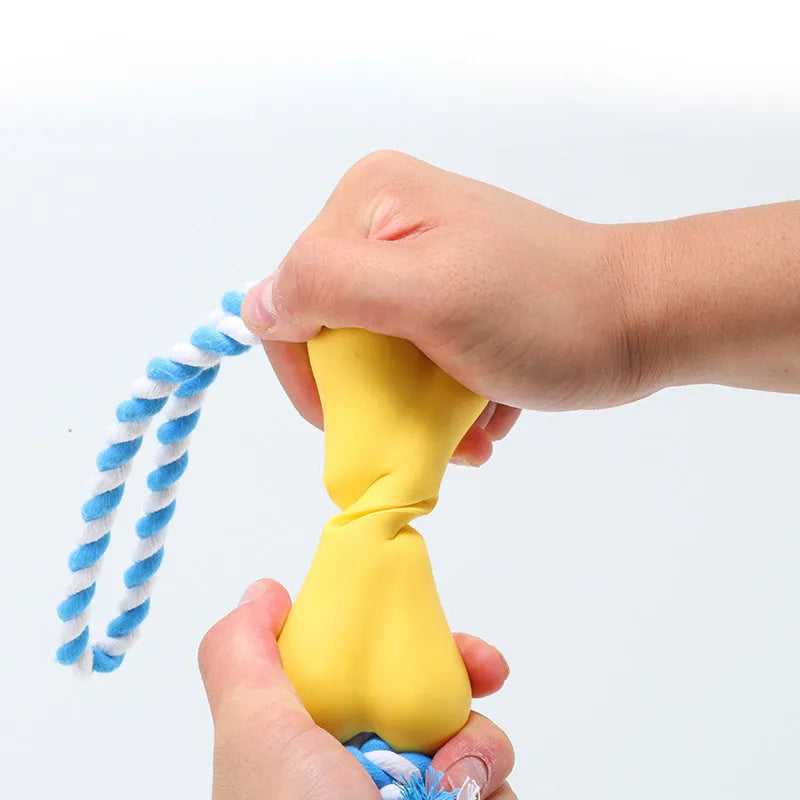 Green porous bone dog chew toy with rope knot texture for treat insertion and dental stimulation