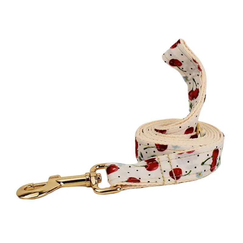 Red cherry print dog collar set with light gold buckle and matching accessories