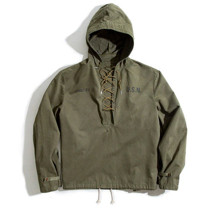 Rugged military-style hooded jacket for men made of durable cotton fabric with wind-resistant features and classic design
