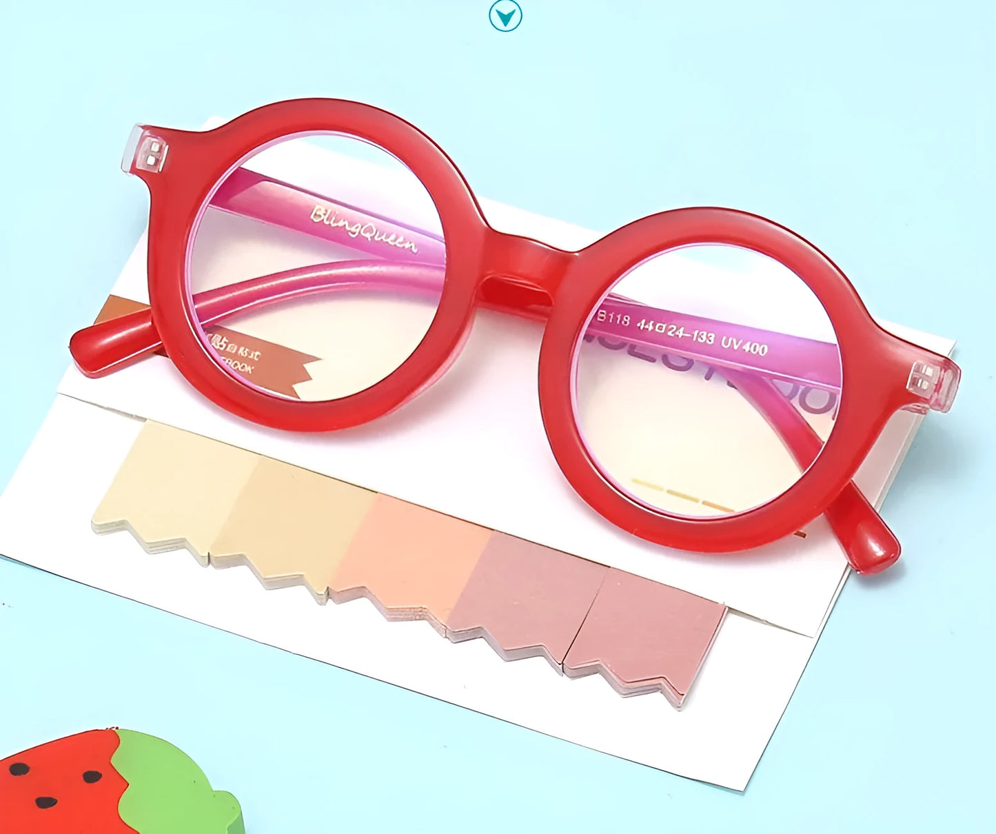 Retro round frame anti blue light glasses in various colours on a plain background