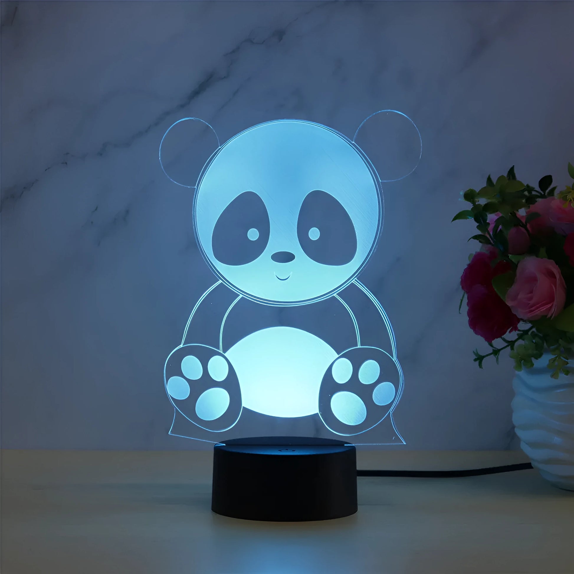 Panda decorative LED night light with remote control showing seven colour options on acrylic panel.