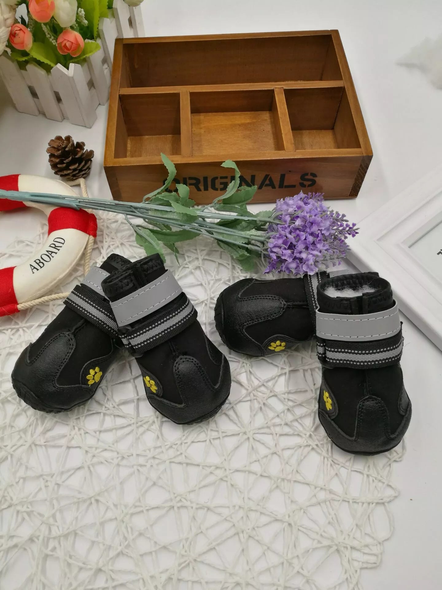 Black waterproof dog shoes with non-slip soles and adjustable fuzzy belts