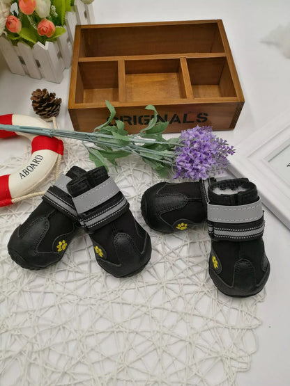 Black waterproof dog shoes with non-slip soles and adjustable fuzzy belts