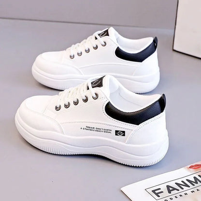 Women's white Korean-style lace-up pumps with a cross strap detail and a mid heel.