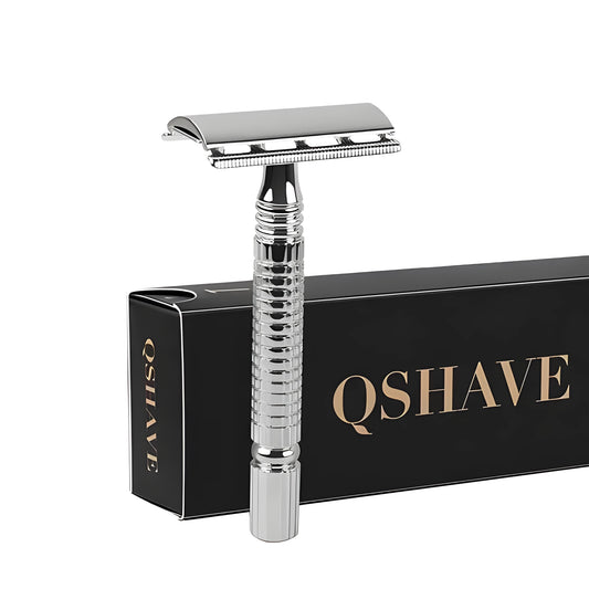 Chrome-plated double-edged safety razor with textured brass handle and storage box.