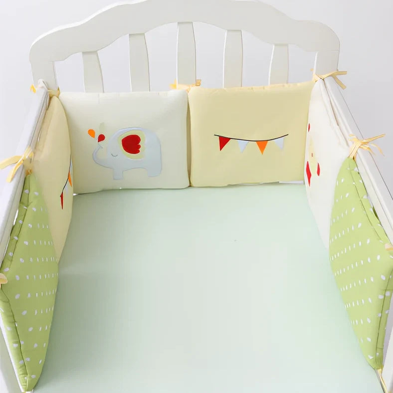 Six 30x30cm cotton baby bed protection panels with hard cotton filling arranged around crib
