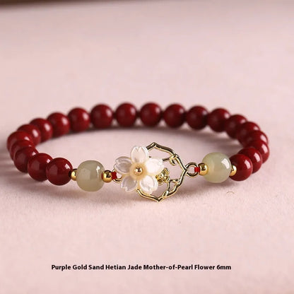 Handcrafted Hetian Jade New Chinese style bracelet in cinnabar with white butterfly, lotus and bells of Ireland motifs