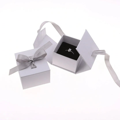 Square grey jewellery gift box with ribbon bow measuring 5x5cm for ring and earring storage