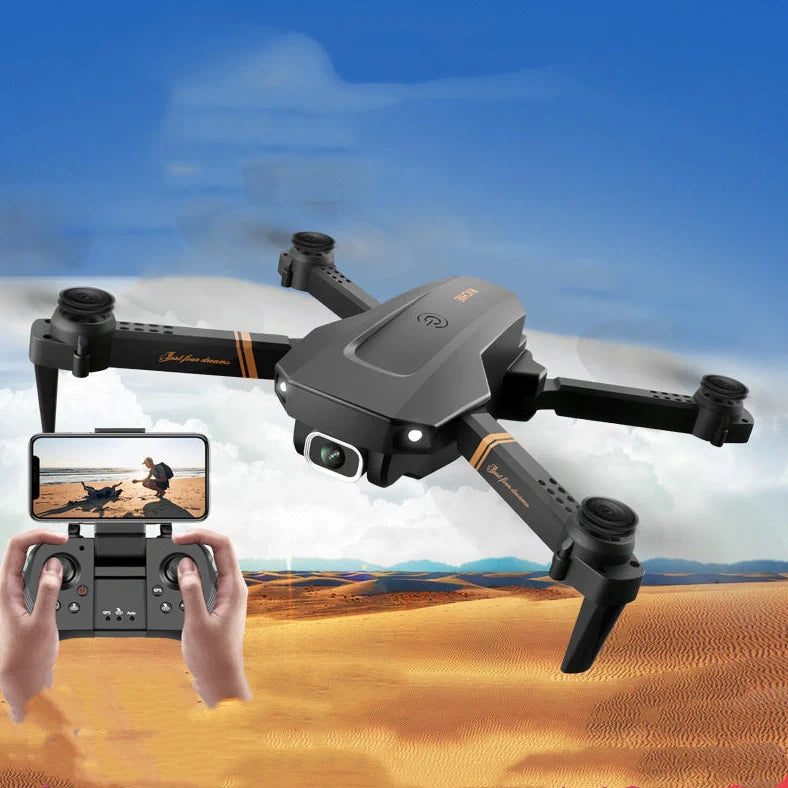 Black folding drone with 4K camera, protective frames, and remote control on grey background
