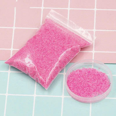 Magical self-adhesive space sand in various colors, allowing for endless creative sculpting and molding even when submerged in water