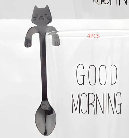 Stainless steel coffee spoon with cartoon cat handle design showing 11.7cm measurement scale